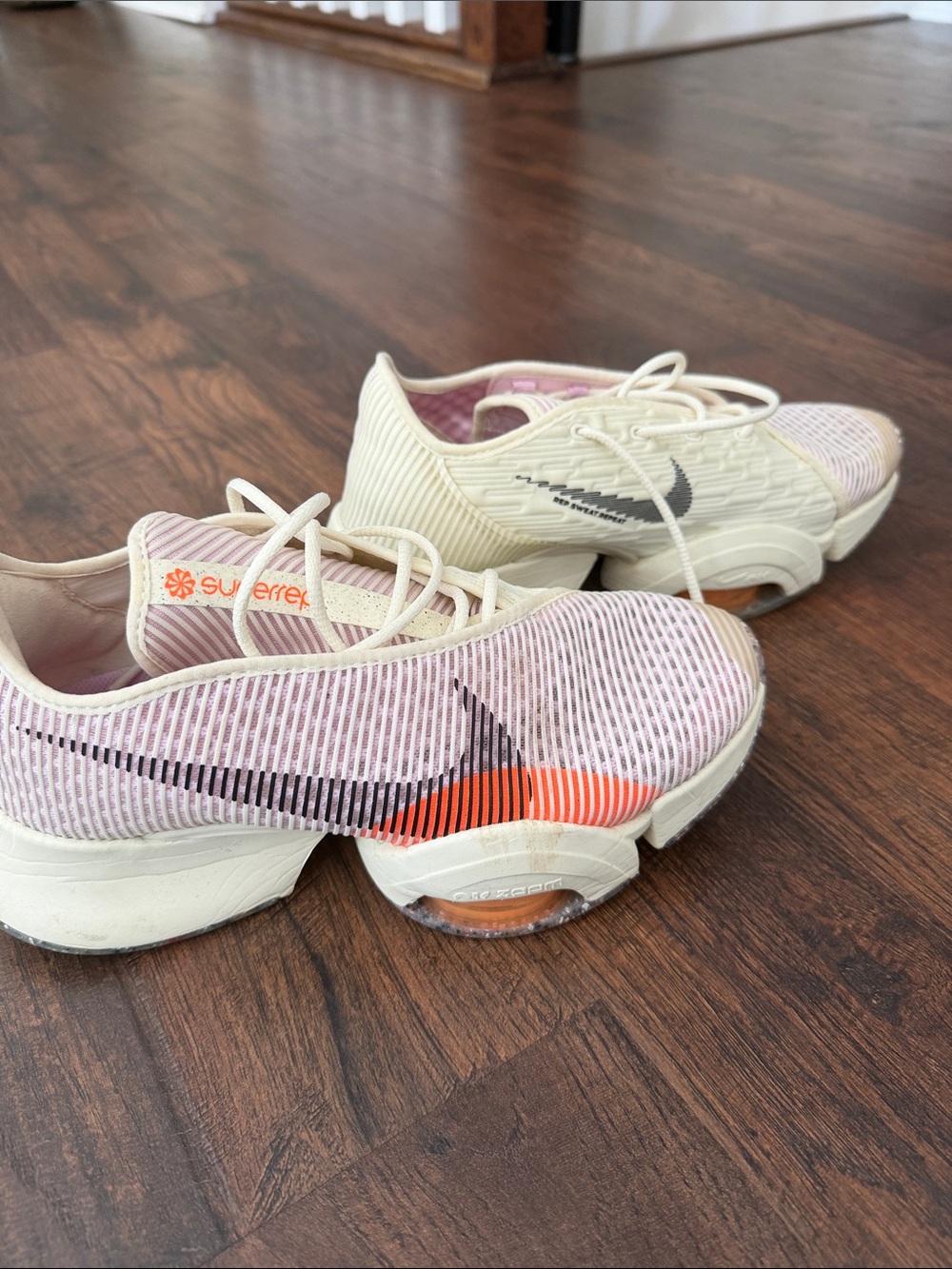 Nike Women’s Pink Cream Athletic Training Shoes with Orange Accent